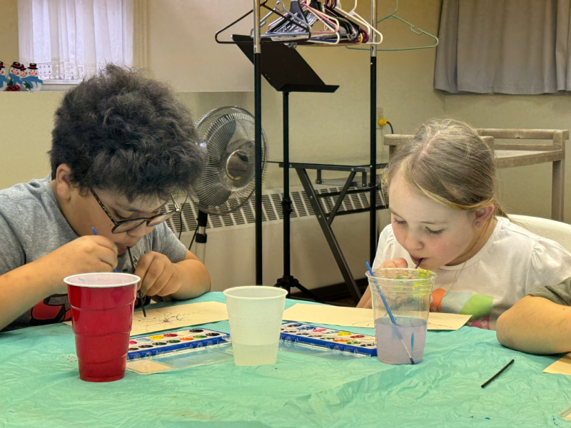 Two children doing an art project