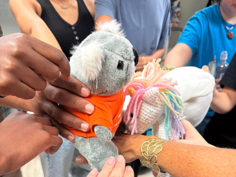 A stuffed Koala bear and unicorn