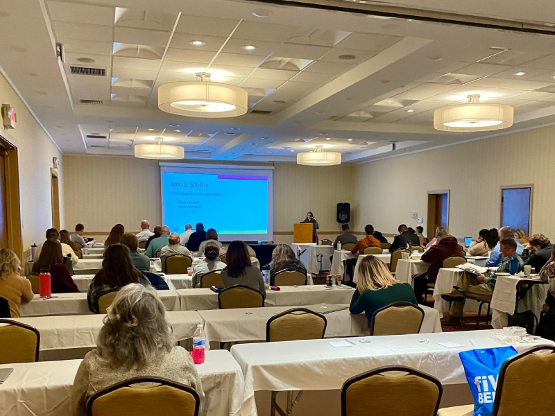 A group of people gather in a conference room